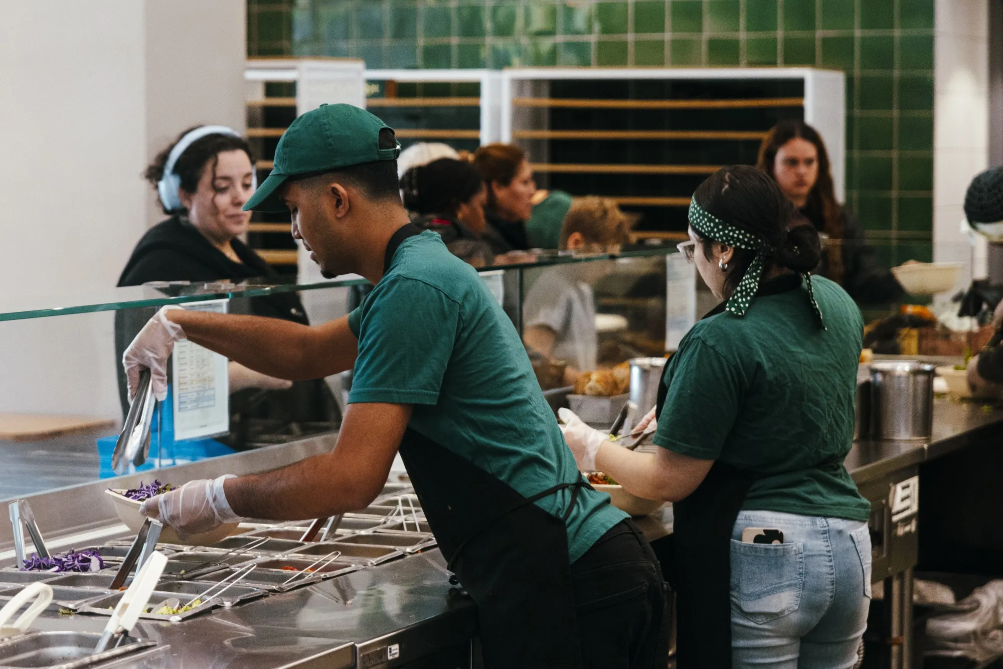 Workers inside a Sweetgreen restaurant in New York.