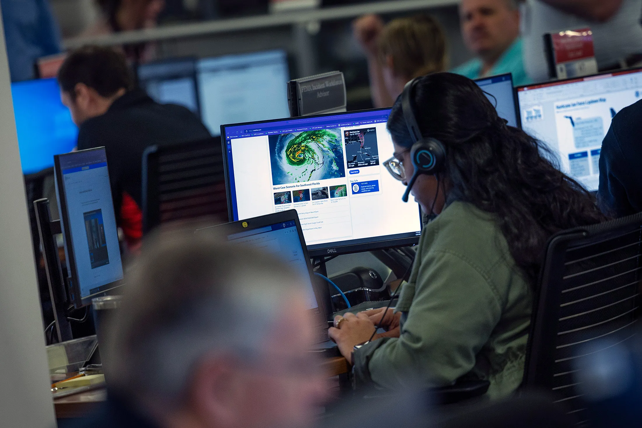 Technicians monitor Hurricane Ian inside the National Response Coordination Center at the FEMA headquarters in Washington, DC, on Sept. 28, 2022.