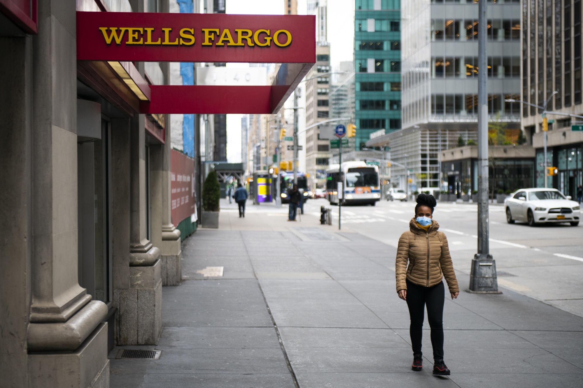 A pedestrian walks past a&nbsp; Fargo &amp; Co. Bank branch in New York, U.S.