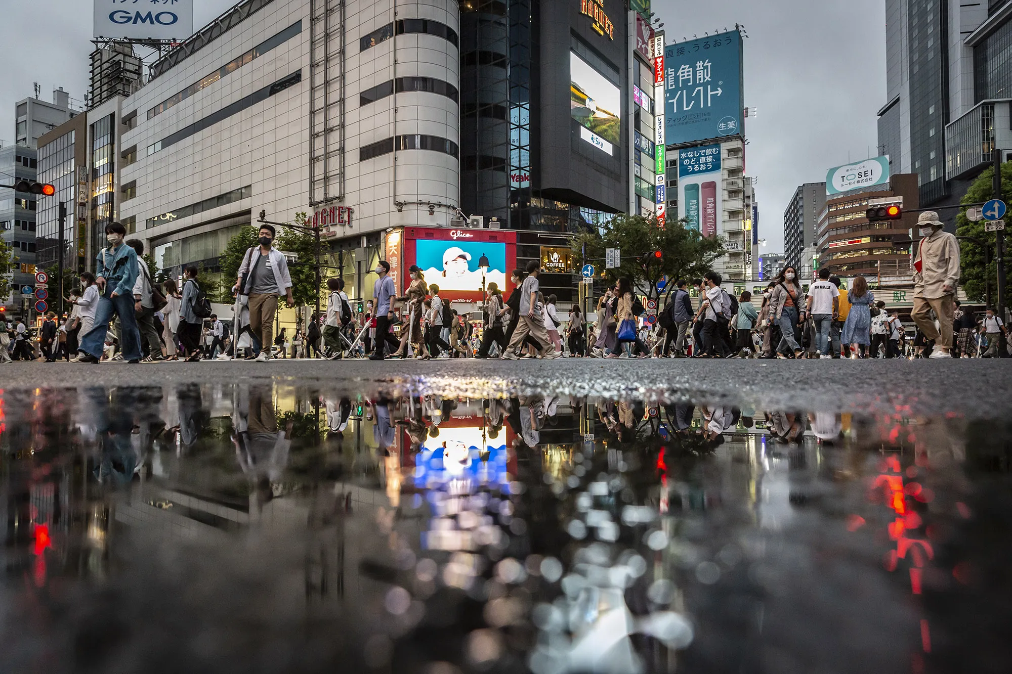 People cross Shibuya crossing in Tokyo, on Aug 16.