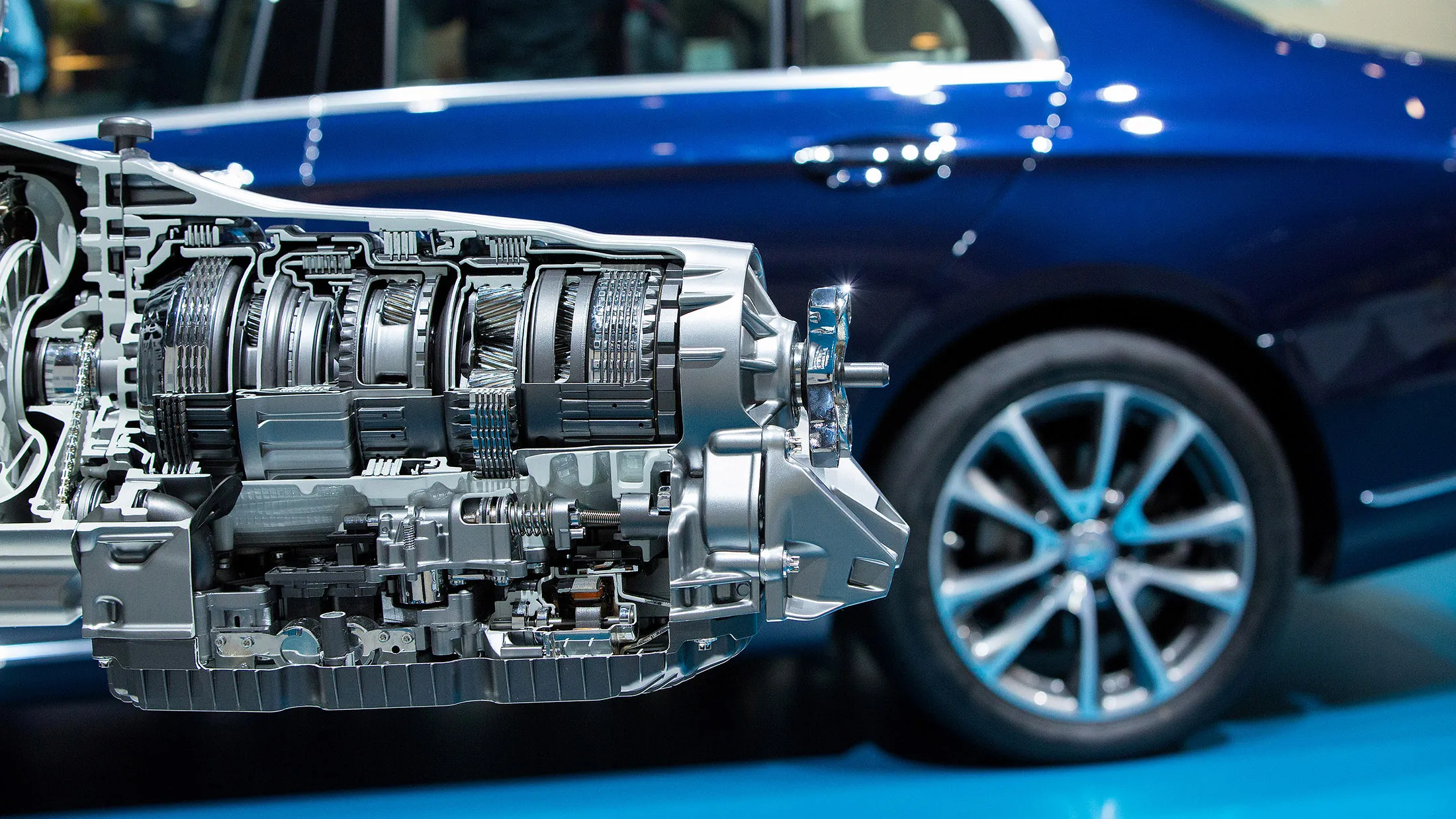 A diesel all-aluminum 4-cylinder OM 654 unit combustion engine sits on display beside a Mercedes-Benz E220 automobile during Daimler AG's TecDay Road to the Future event in Stuttgart, Germany, on Thursday, June 9, 2016. Mercedes-Benz will start selling a fuel-cell electric version of its GLC sport utility vehicle next year, an effort to broaden the appeal of the technology with the first publicly available battery that can be charged both with hydrogen and at a wall socket.

