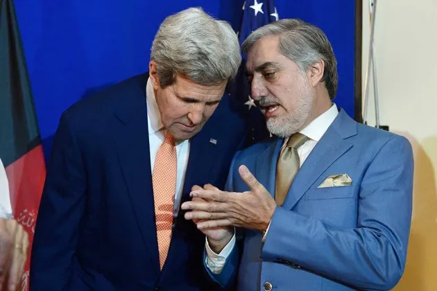U.S. Secretary of State John Kerry (left) talks with Afghan presidential candidate Abdullah Abdullah at a press conference with candidate Ashraf Ghani in Kabul on Aug. 8