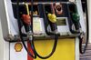 Fuel pump nozzles sit at a Showa Shell Sekiyu K.K. gasoline station in Tokyo, Japan, on Tuesday, July 10, 2018. Showa Shell and Idemitsu Kosan Co. both surged after Idemitsu announced major shareholders and its founding family approved a merger between the two Japanese refiners.