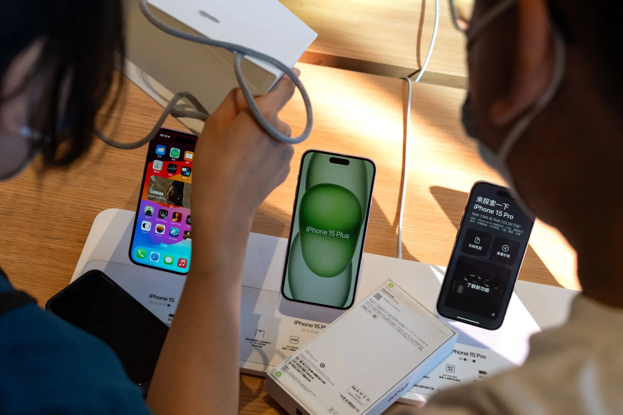 IPhone 15 smartphones&nbsp;at an Apple store in Beijing.