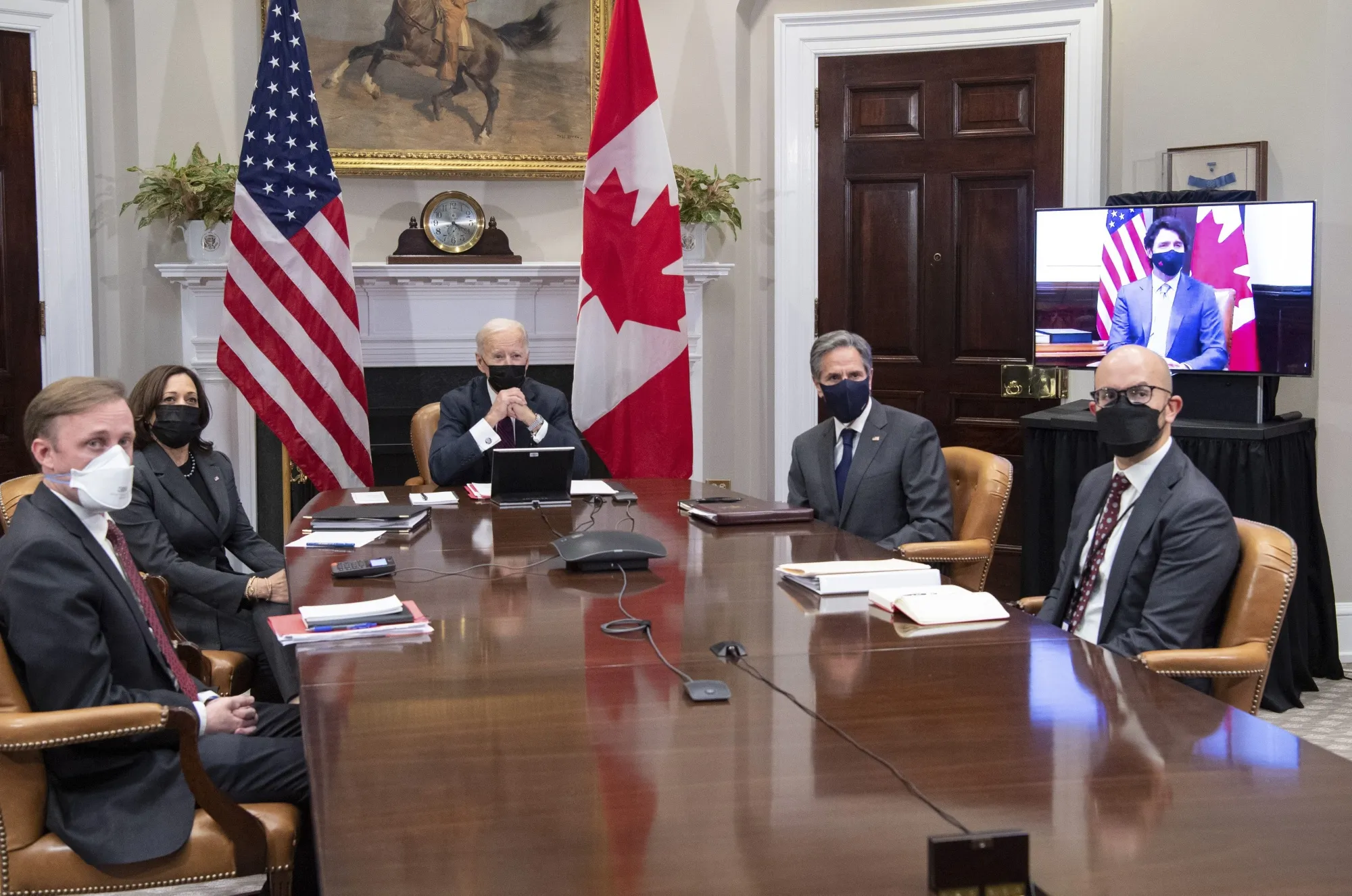 Joe Biden, center, during a virtual bilateral meeting with Justin Trudeau,&nbsp;on screen,&nbsp;in the Roosevelt Room of the White House.