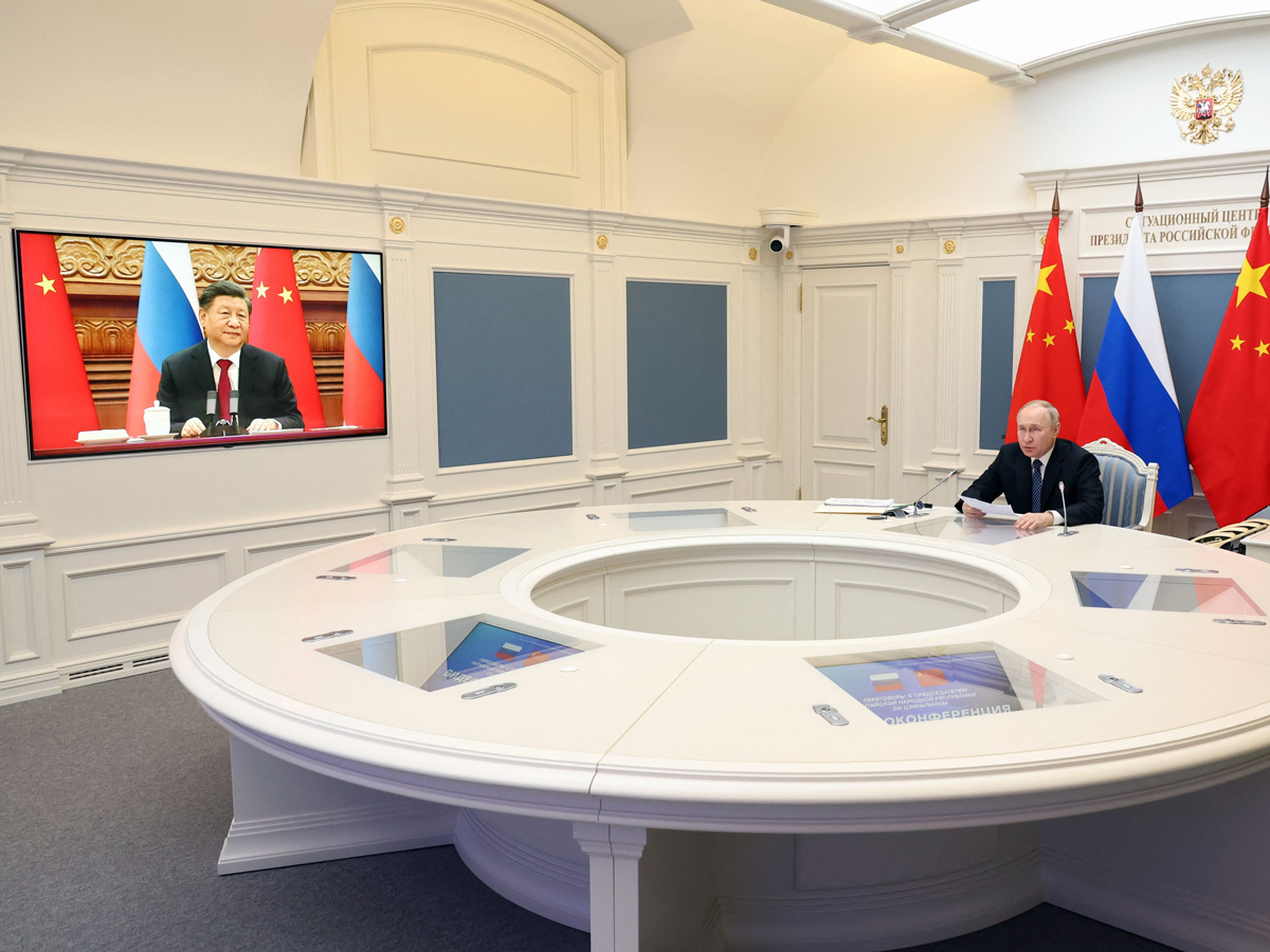 Russian President Vladimir Putin speaks with Chinese President Xi Jinping via video link at the Kremlin in Moscow on Dec.&nbsp;30.