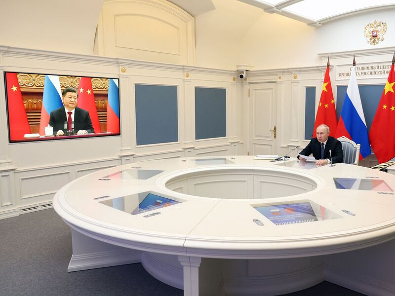 Russian President Vladimir Putin speaks with Chinese President Xi Jinping via video link at the Kremlin in Moscow on Dec. 30.