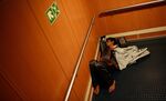 A migrant sleeps in a stairwell between decks onboard a Blue Star ferry during a ten hour journey from the island of Kos to the Greek mainland port of Piraeus on Tuesday. Government data showed 413,000 refugees arrived in Germany this year through August.
