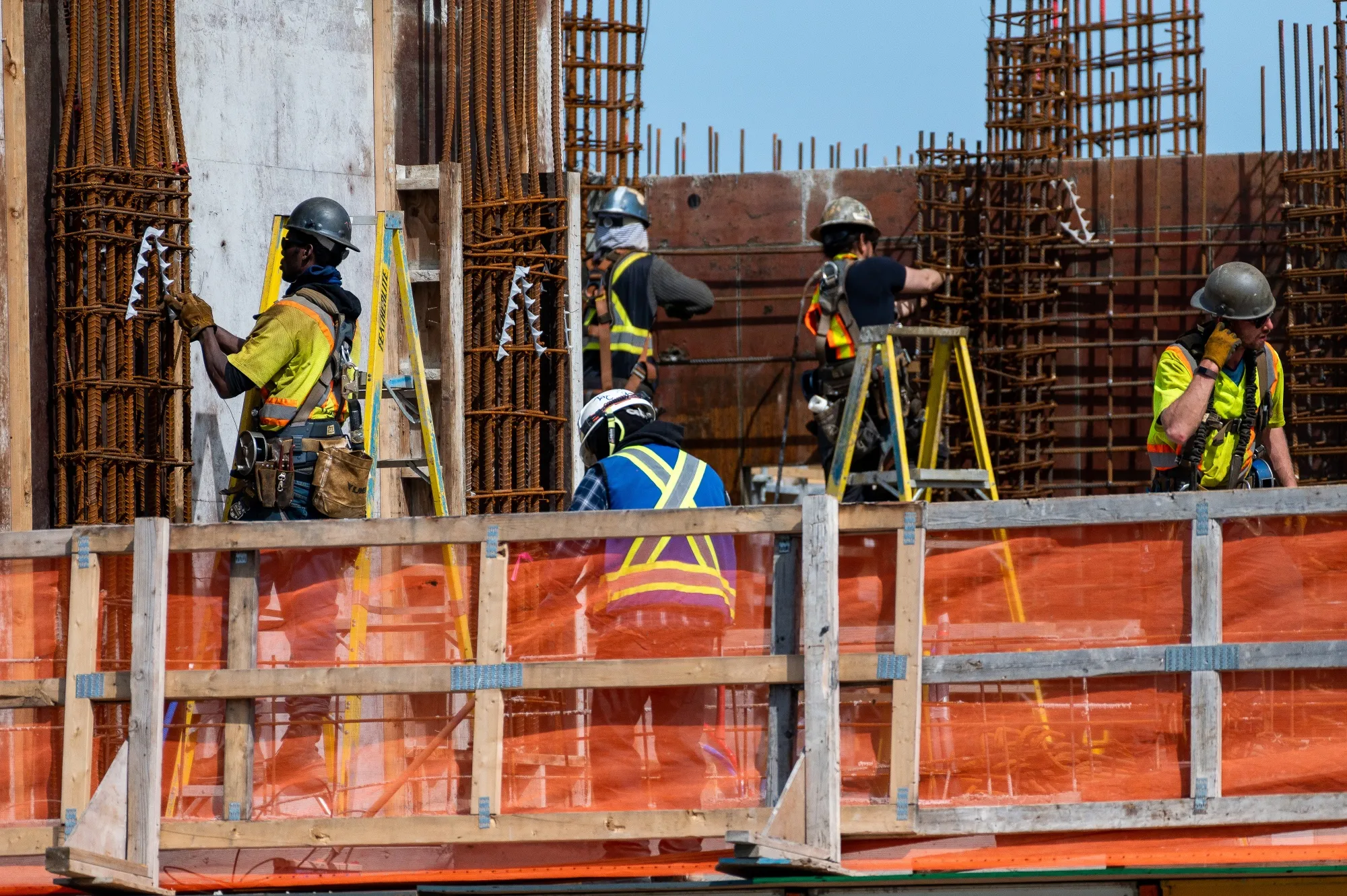 Workers build a condo building in Victoria, British Columbia. Construction is one of the sectors struggling most with labor shortages in Canada.