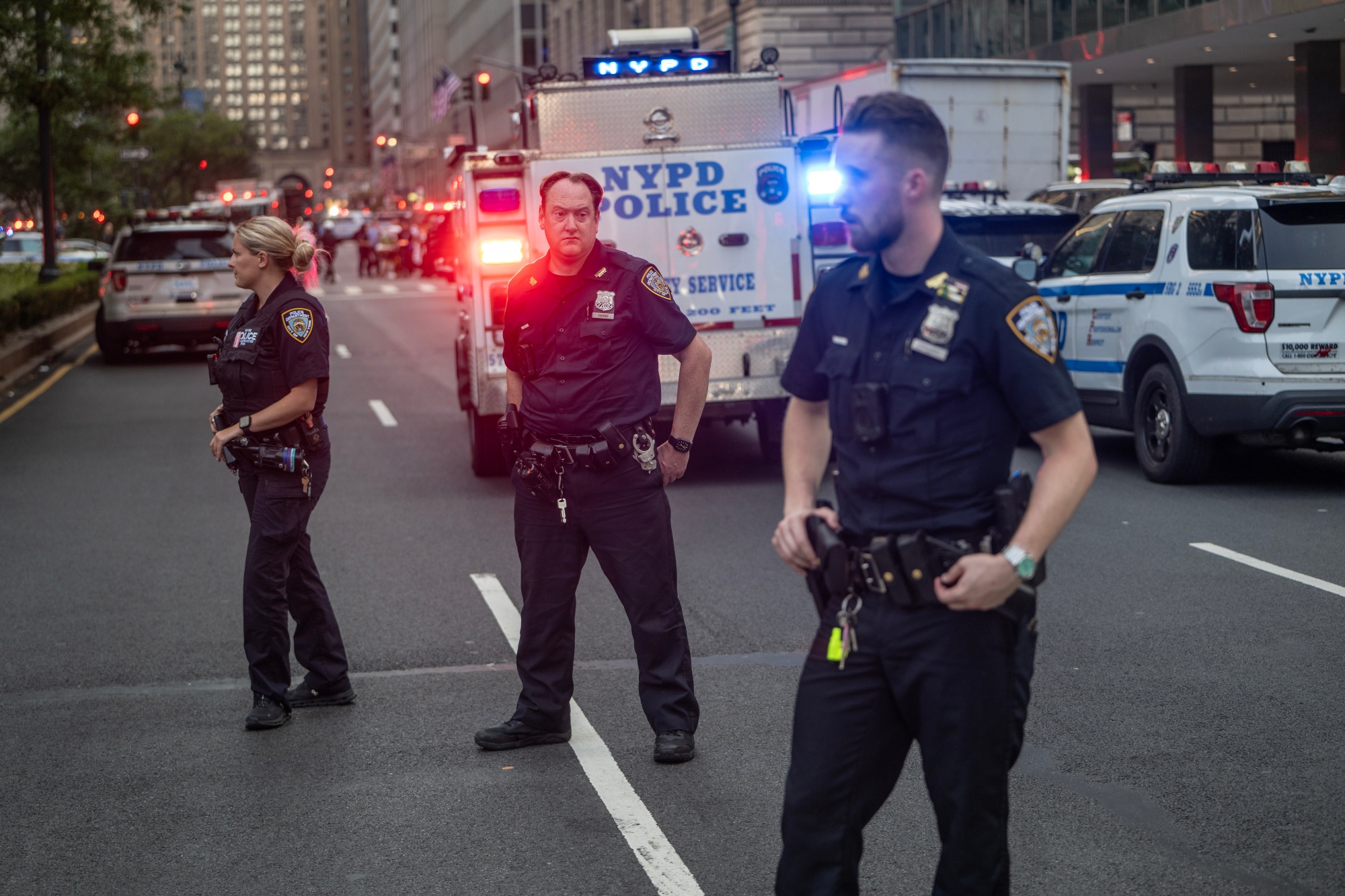 NYPD officers respond to the scene of a shooting in New York on July 28.