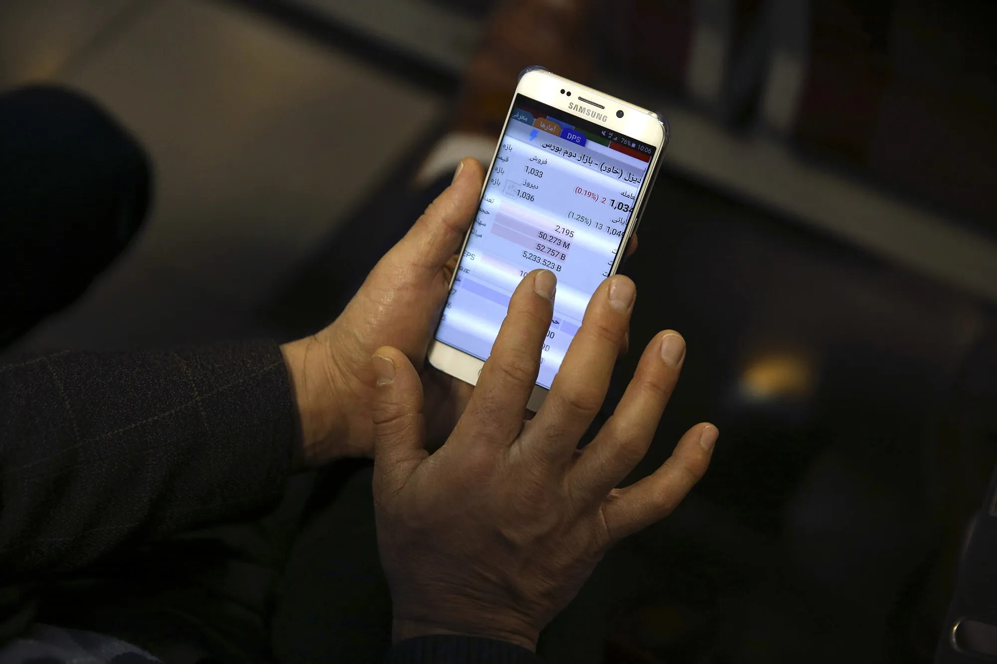A shareholder monitors stock prices&nbsp;at the Tehran Stock Exchange.