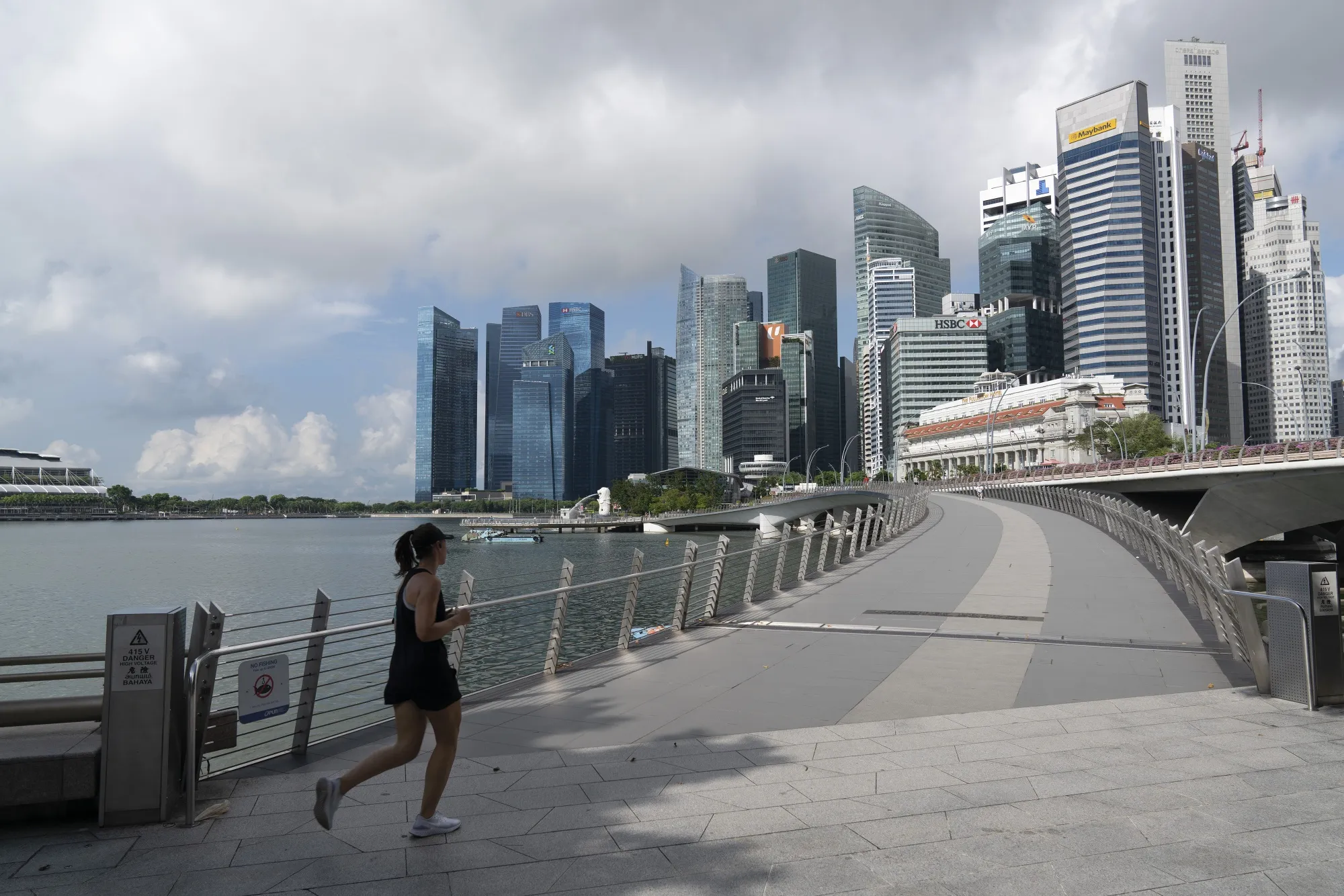 A jogger runs toward the Central Business District in Singapore on July 6.