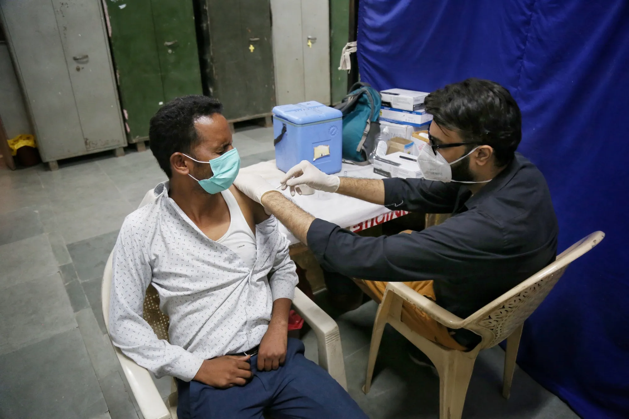 A health worker administers a Covid-19 vaccine in New Delhi on Oct. 16.