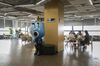 Employees sit at a table near an Ant Group Co. mascot displayed at the company's headquarters in Hangzhou, China, on Monday, Sept. 28, 2020.