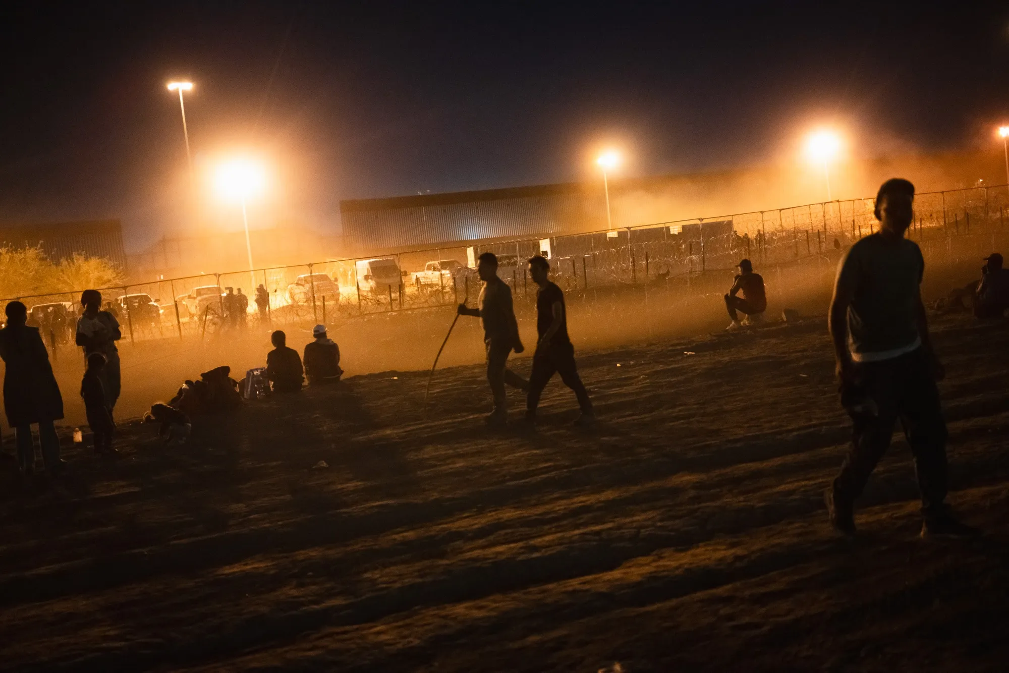 Migrants on the bank of the dry riverbed of the Rio Grande at the US-Mexico border in Ciudad Juarez, Chihuahua state, Mexico, on April 24.