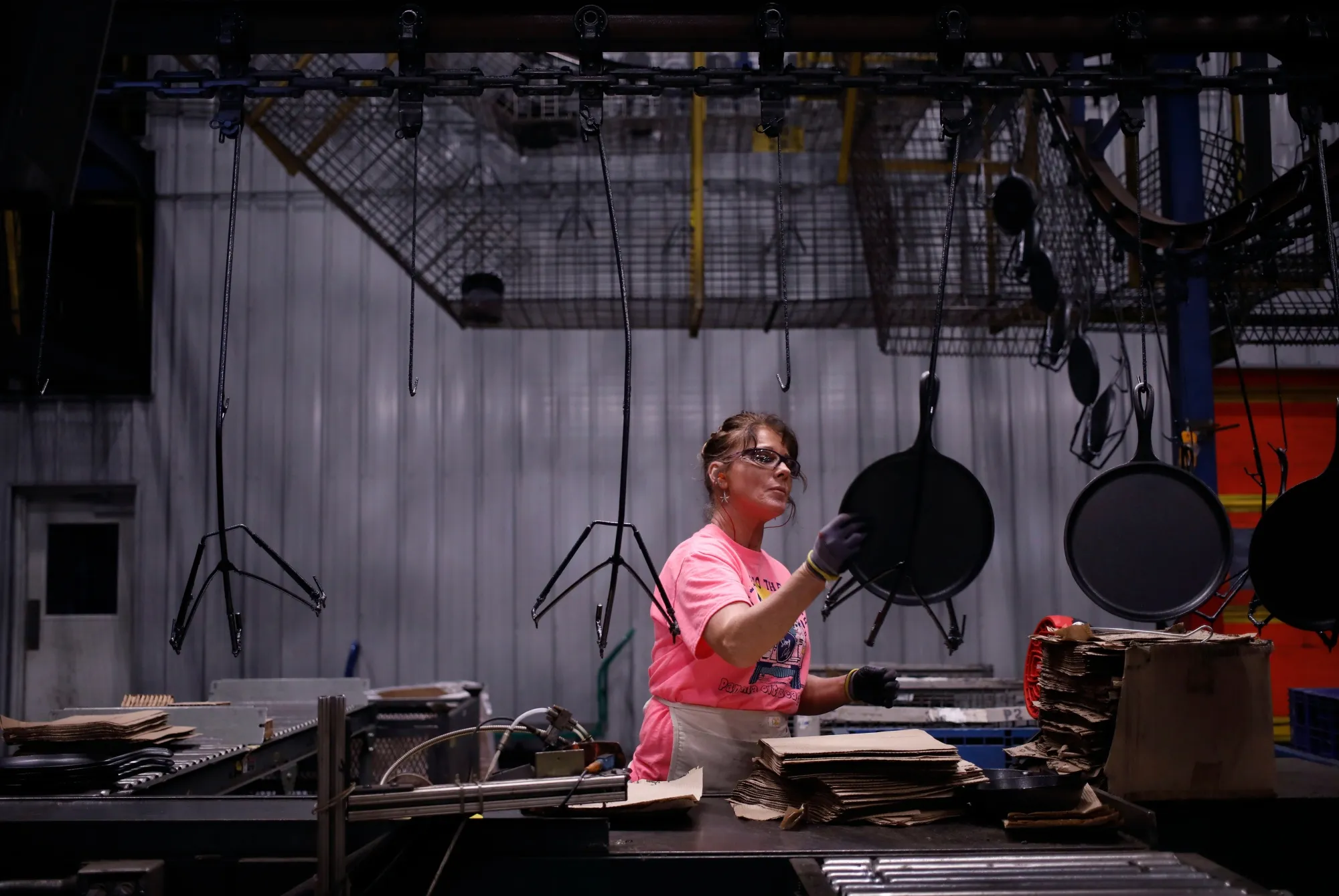 A worker packages cast iron cookware at a factory in South Pittsburg, Tennessee.