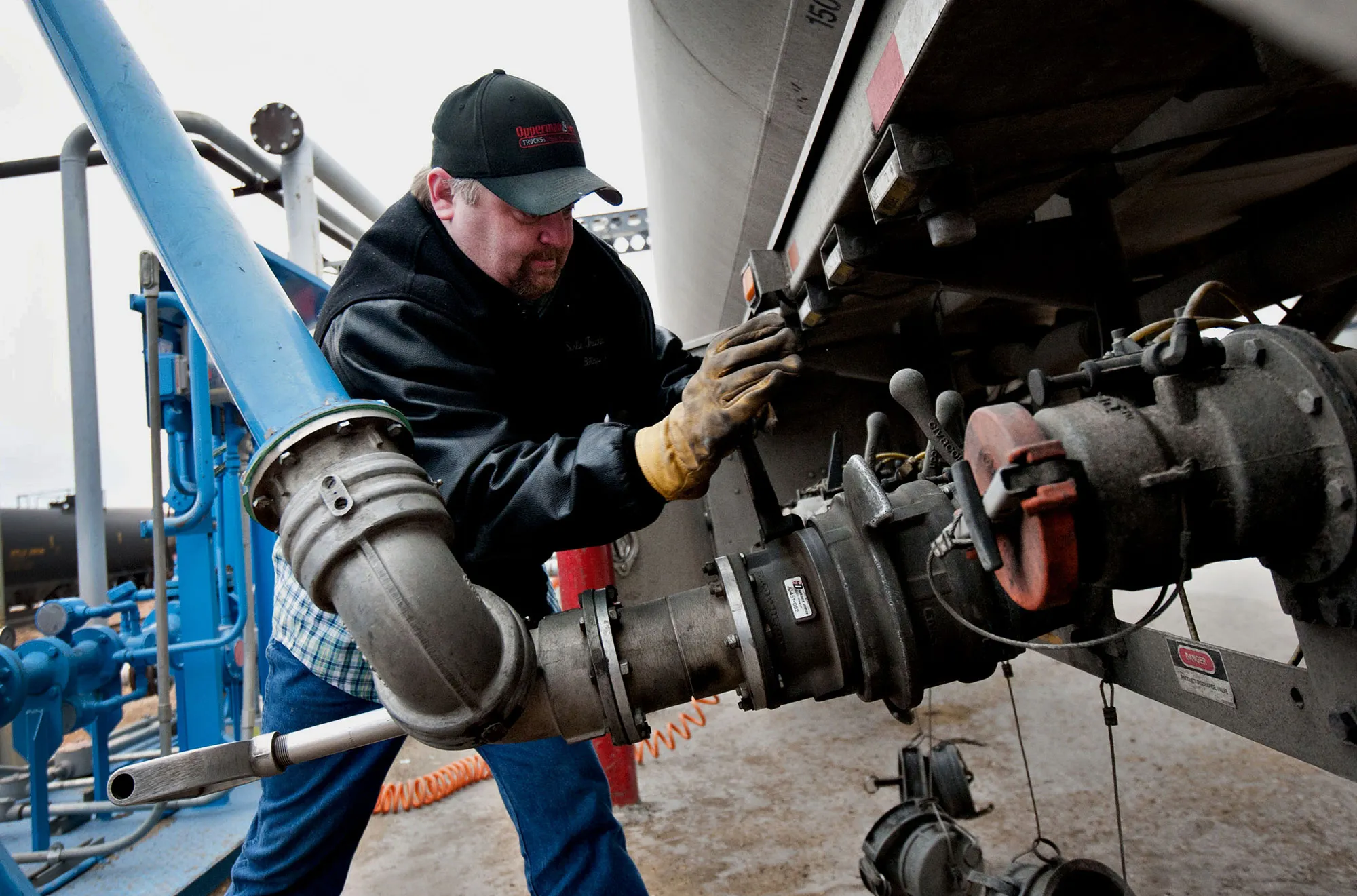 A truck driver loads a tanker trailer bound for an Exxon refinery in Montana with denatured alcohol, or ethanol, at an ethanol plant in Underwood, North Dakota.
