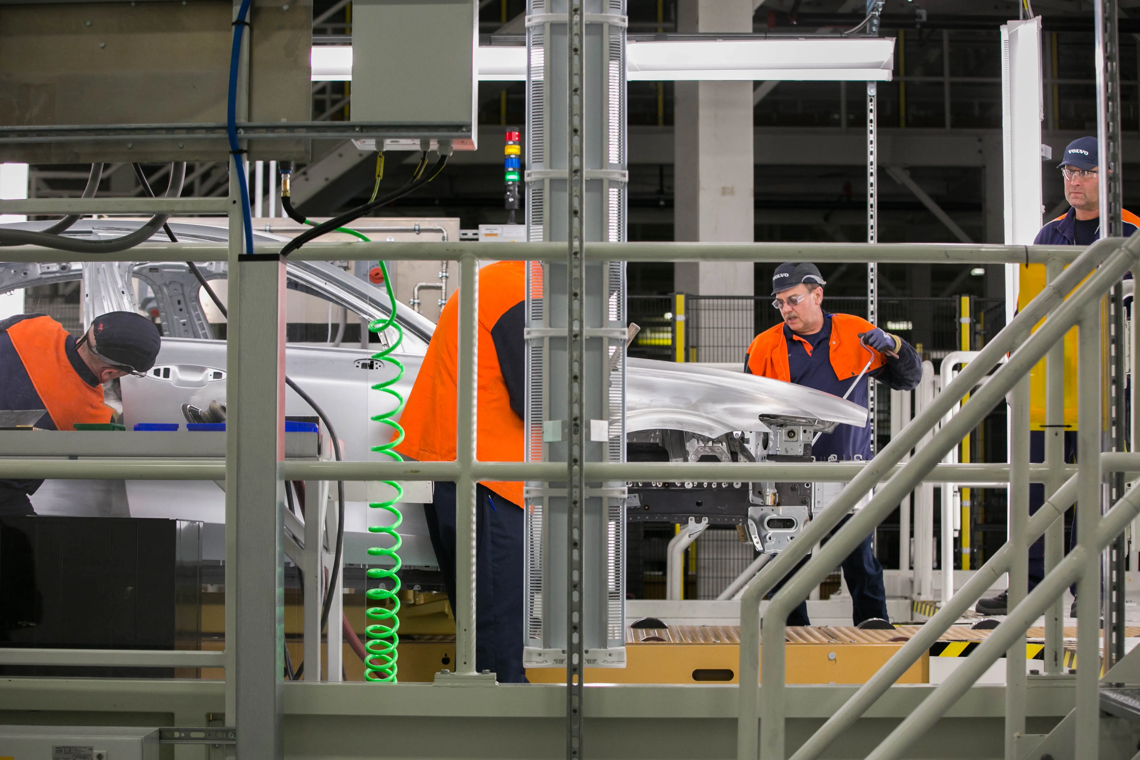 Workers inspect the body of a S60 at the Volvo Cars USA plant.