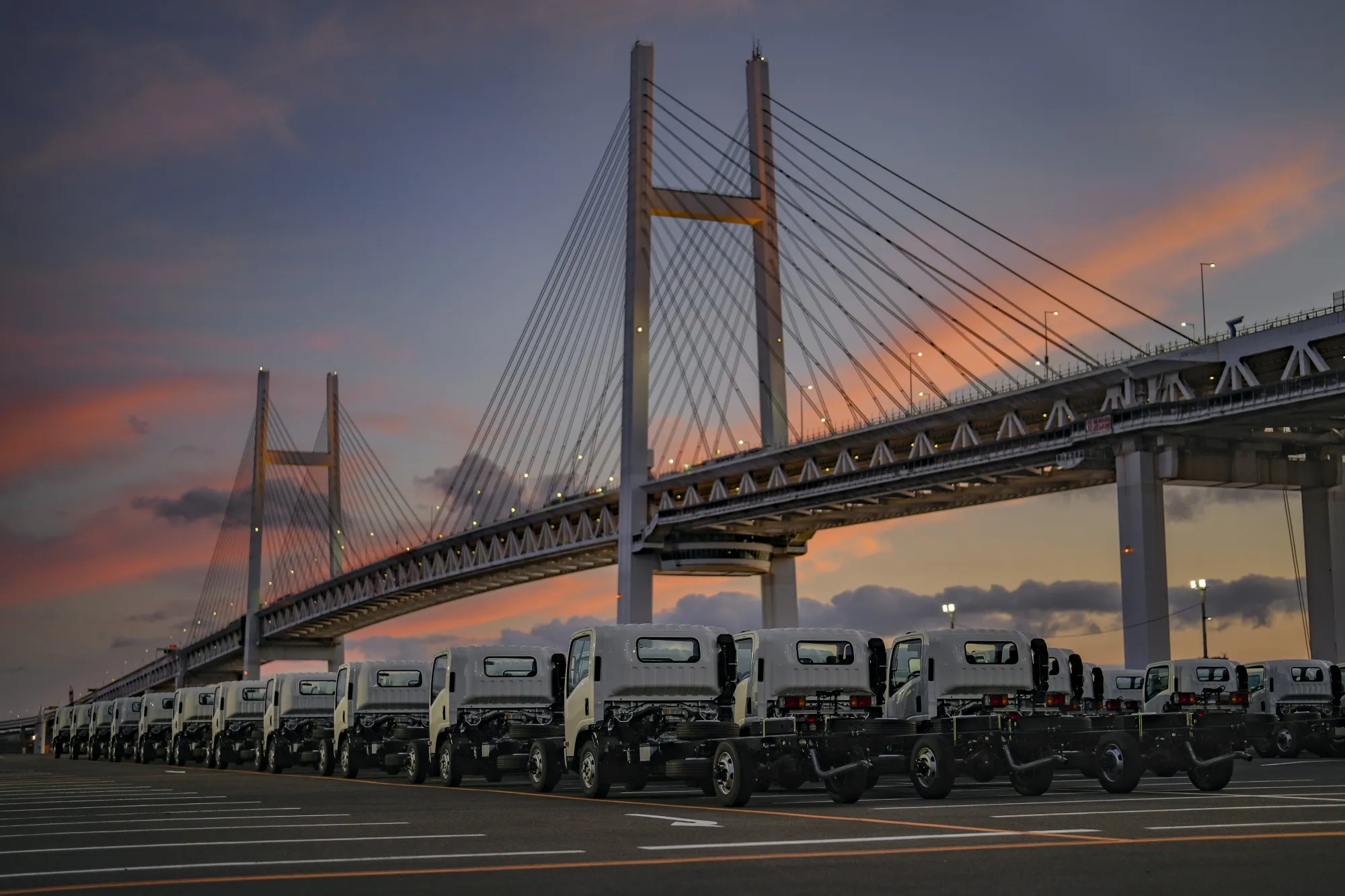 New trucks bound for shipment at a port in Yokohama, Japan.