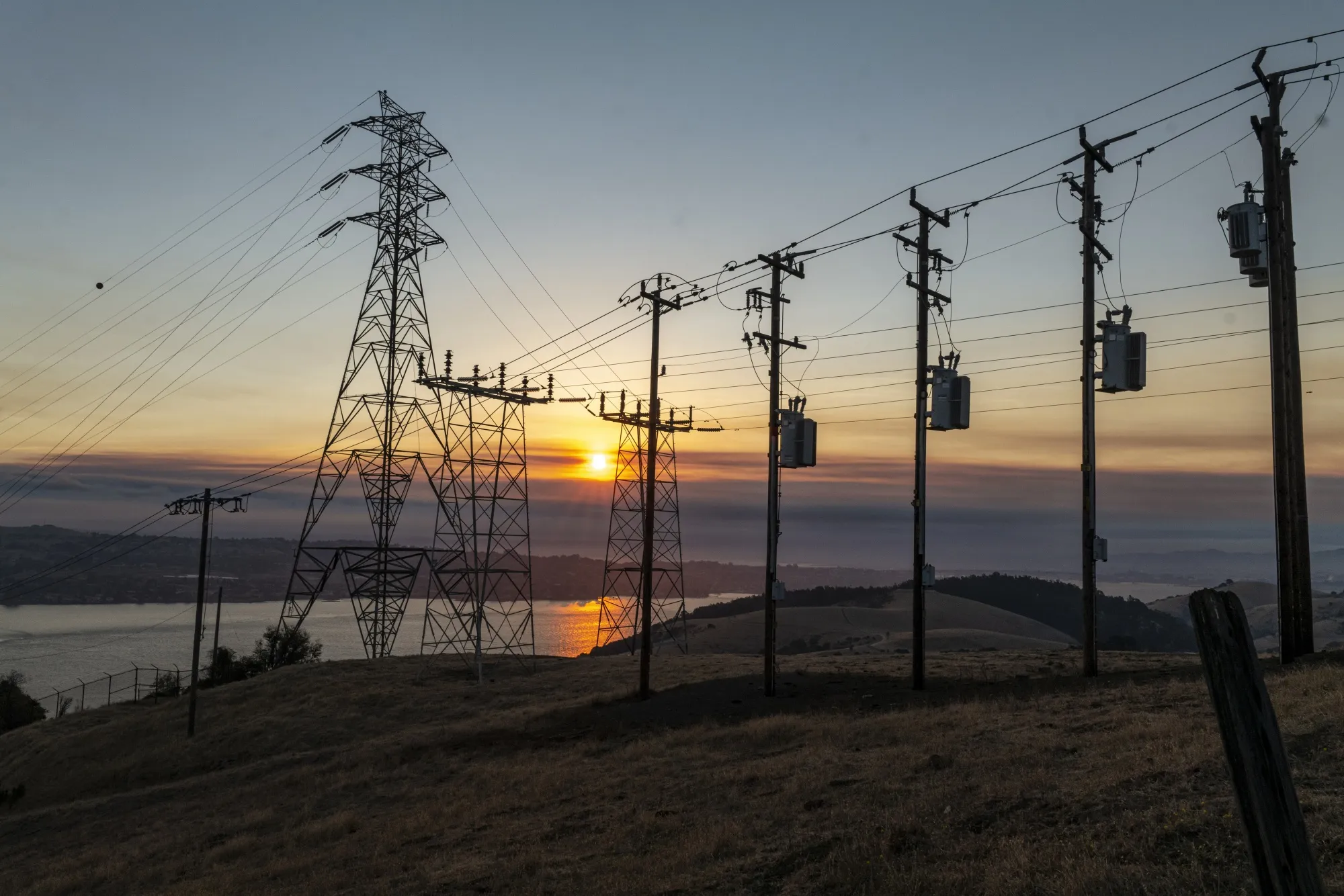Power lines and transmission towers at sunrise in Crockett, California, U.S., on&nbsp;Aug. 19.