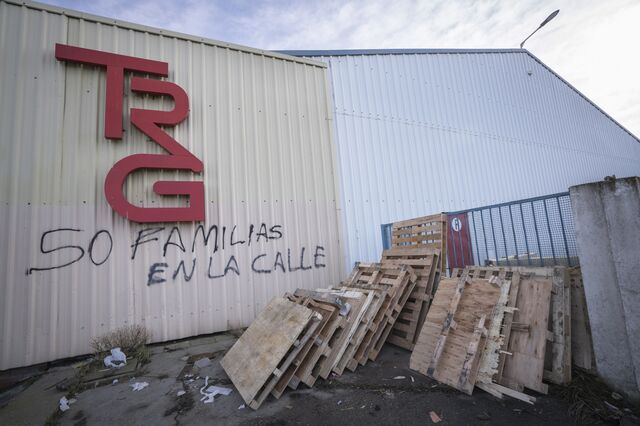 Graffiti on the facade of the recently closed Textil Rio Grande reads "50 Families On The Street."