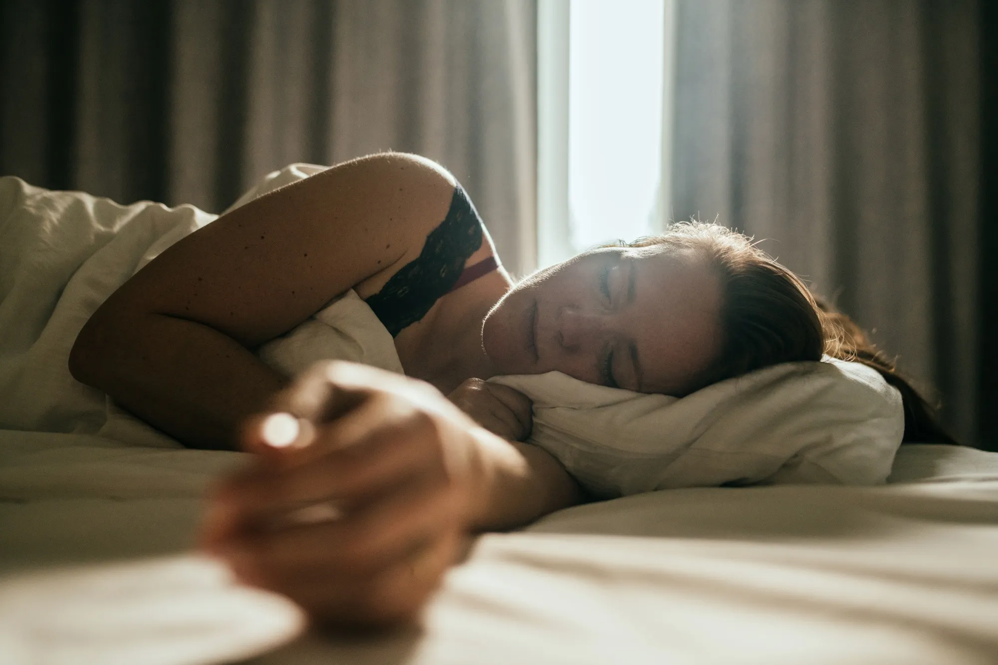 Woman sleeping in bed. 