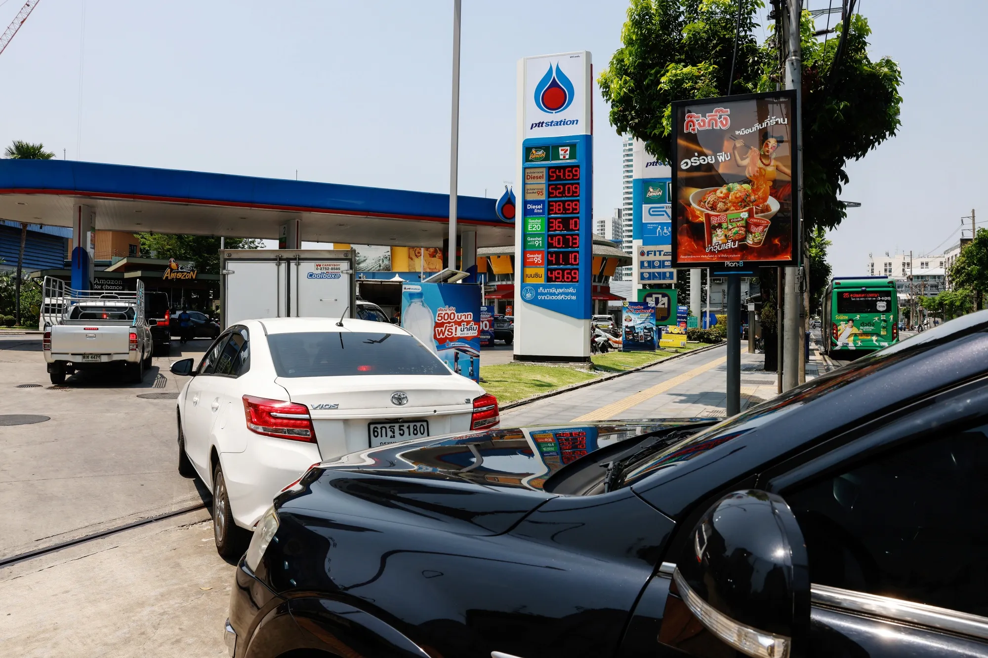 Vehicles queue at a PTT Pcl petrol station in Bangkok, Thailand, on March 26.