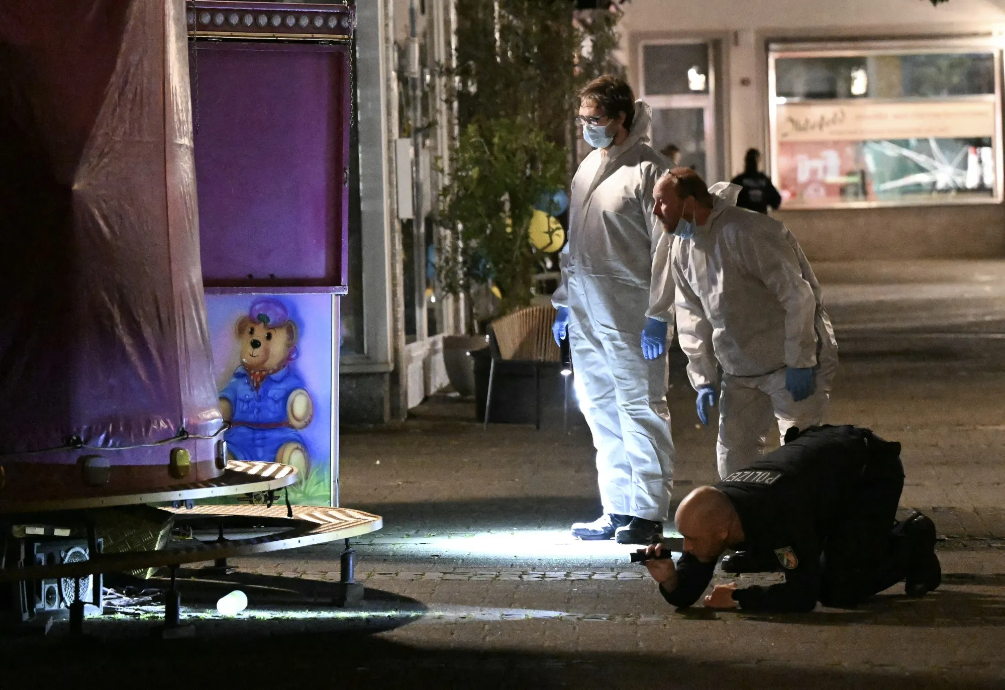 Forensic police inspect the area where at least three people were killed and several injured when a man attacked them with a knife&nbsp;in Solingen, Germany, on early Aug. 24.