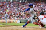 New York Mets' Francisco Lindor hits a solo home run during the fifth inning of a baseball game against the Cincinnati Reds in Cincinnati, Monday, July 4, 2022. (AP Photo/Aaron Doster)