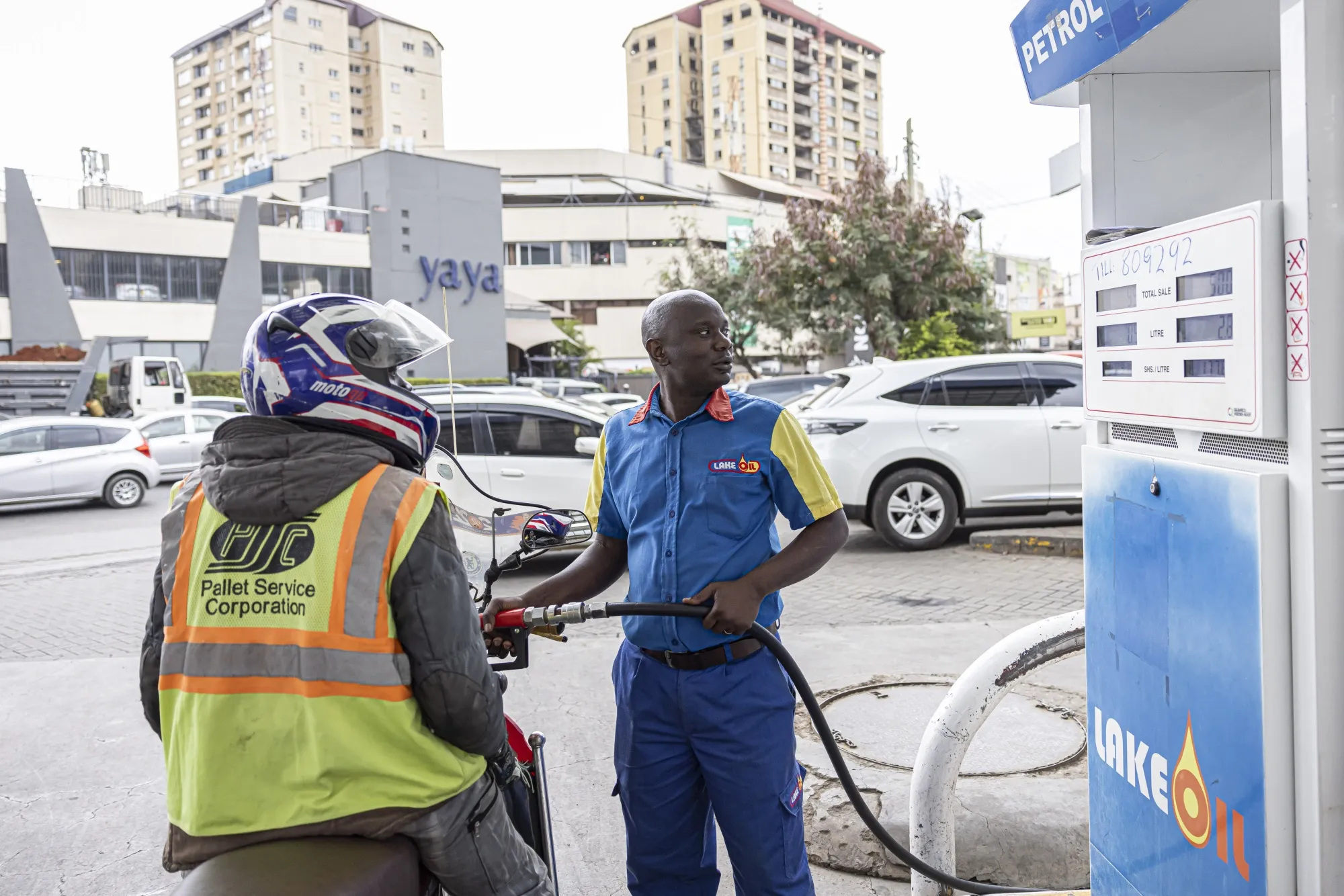 An attendant refuels a motorcycle taxi at a&nbsp;petrol station in Nairobi, Kenya.