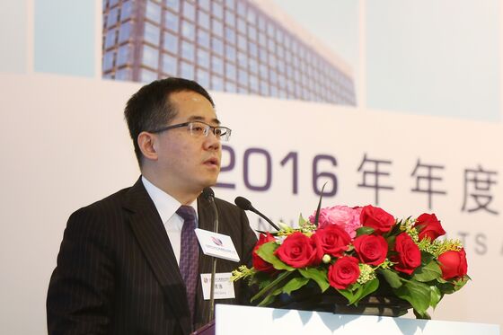Inside the Race to Avert Disaster at China’s Biggest ‘Bad Bank’