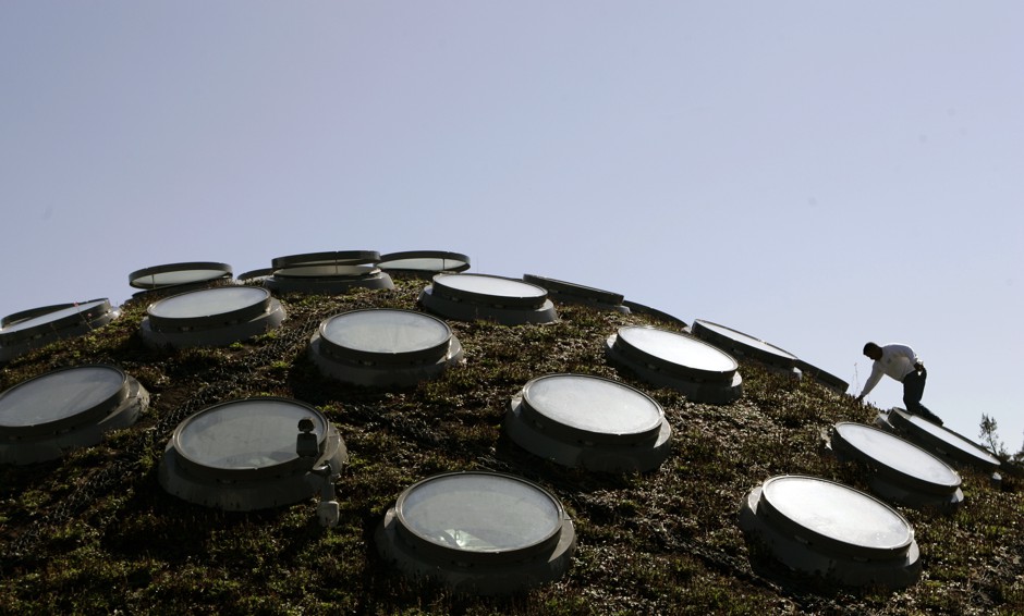 A worker climbs among skylights on the &quot;living roof&quot; at the California Academy of Sciences in Golden Gate Park in San Francisco.