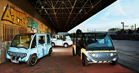 France Craft's all-electric vehicles stand in this undated handout photo released to the media on Wednesday, Jan. 6, 2015. The cube-shaped vehicles made by Marc Chevreau’s startup, France Craft, are shipped in a kit and have safety clearance to hit the road in Europe as long as they’re assembled by a professional mechanic.