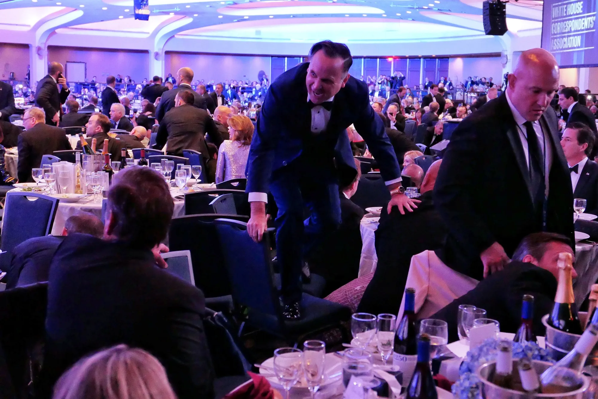White House Deputy Chief of Staff Dan Scavino jumps over a chair at the annual White House Correspondents Association Dinner.