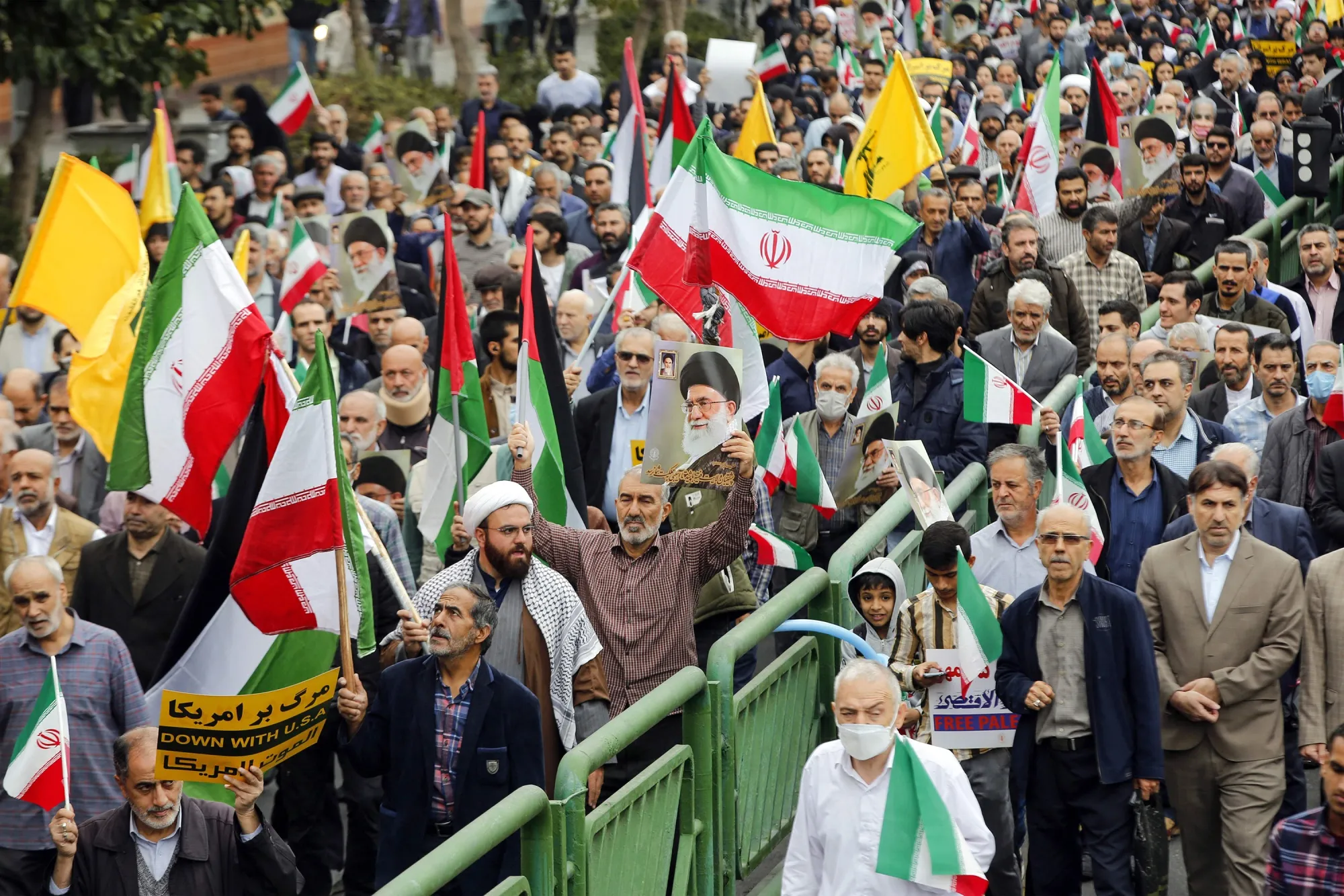 Iranians take part in a&nbsp;rally against Israel on Oct. 13 in Tehran, six days after a surprise attack by Hamas triggered the ongoing war. With an invasion of Gaza imminent, the risk of regional conflict involving Iran threatens more violence, poverty and economic hardship.