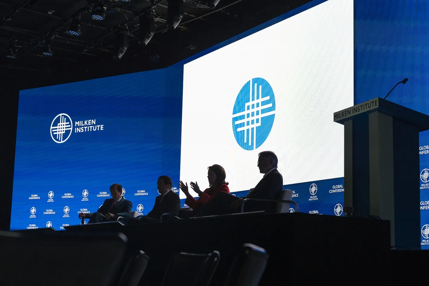 Speakers participate in a panel discussion during the Milken Institute Global Conference in Beverly Hills, California.