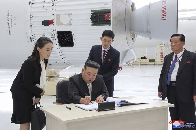 Kim Jong Un and Kim Yo Jong sign a visitor's book at the Vostochny cosmodrome in Russia, in 2023.
