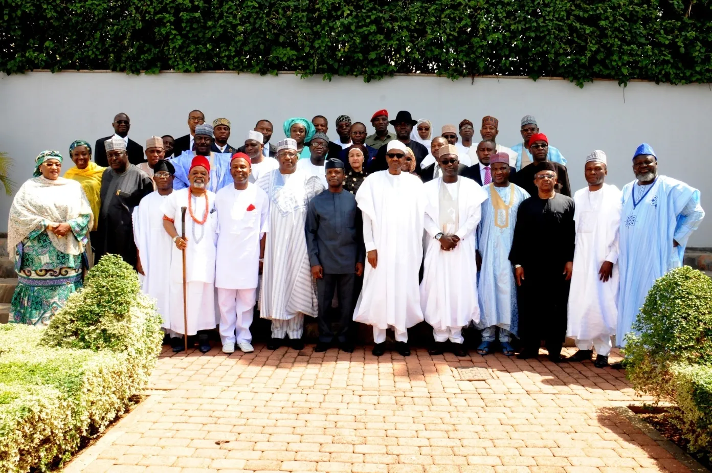 Muhammadu Buhari with newly-appointed ministers at the swearing in ceremony in Abuja, on Wednesday.
