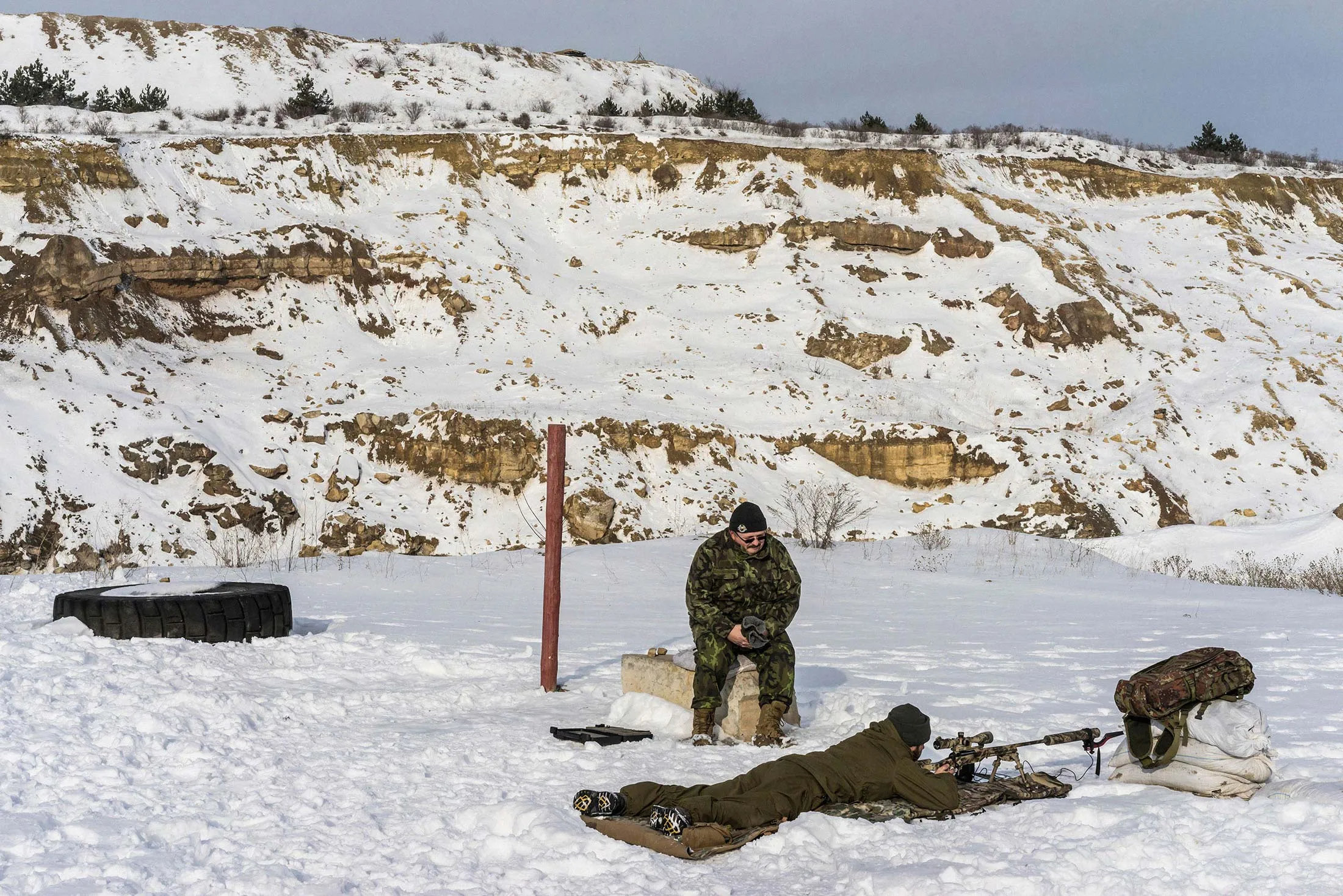 Ruslan Shpakovich, a former rental-car company worker, trains a soldier whose unit relies partly on privately purchased equipment, in Mykolaivka Druha, Ukraine.