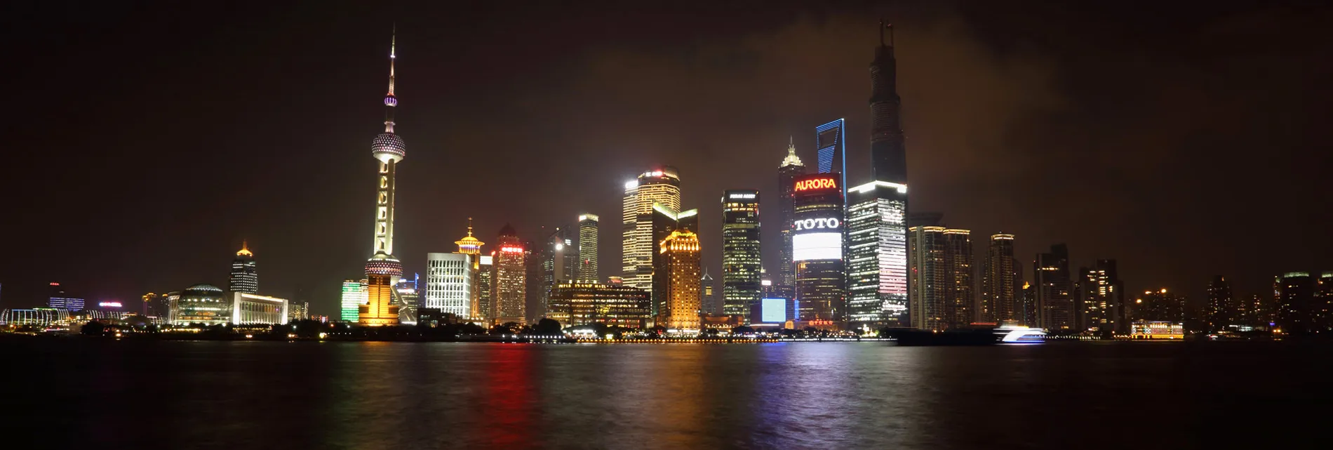 Buildings in the Lujiazui district stand at night, seen from the bund area, in Shanghai.
