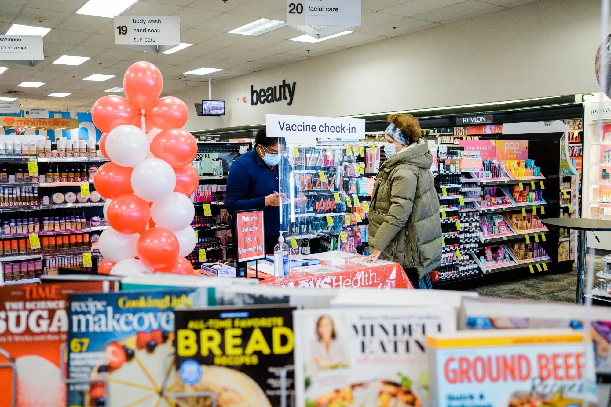 A worker checks in a person&nbsp;to receive a dose of the Moderna Covid-19 vaccine at a CVS Pharmacy in New York, U.S., on&nbsp;Feb. 12.