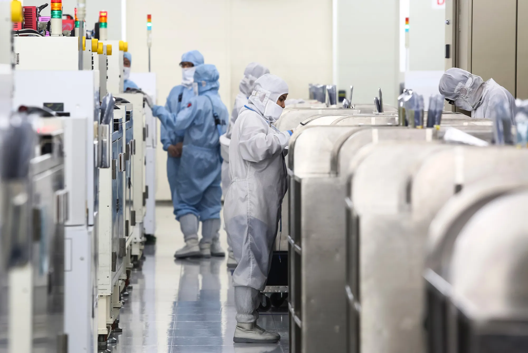 Employees work inside a semiconductor manufacturing&nbsp;facility in Hsinchu, Taiwan.