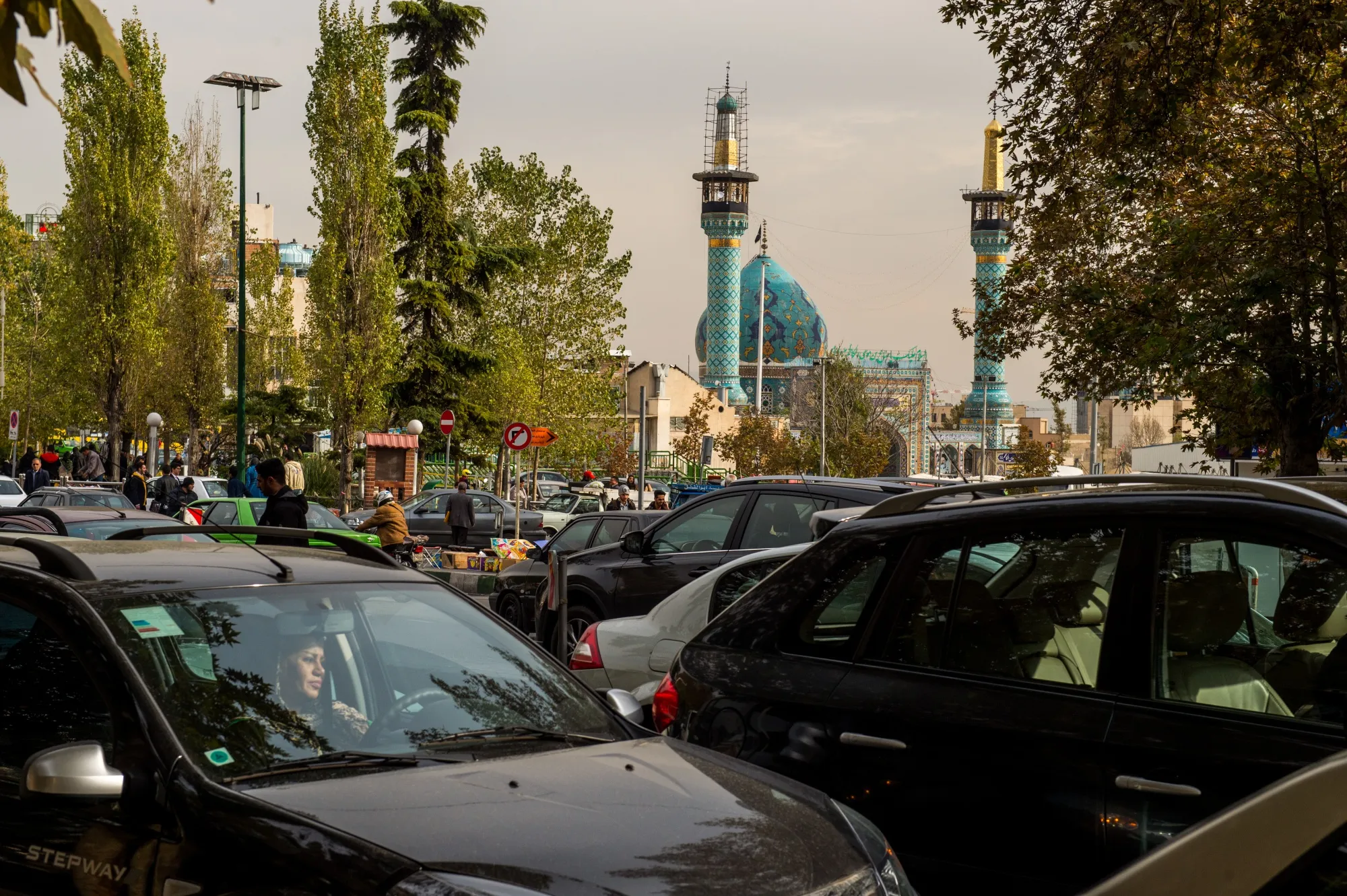 Traffic passes the Imamzadeh Saleh mosque in Tehran