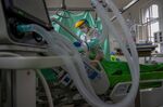 A health worker treats a patient infected with Covid-19 in Budapest.