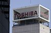 Signage for Toshiba Corp. displayed at the company's headquarters in Tokyo, Japan, on Wednesday, April 7, 2021. Toshiba surged its daily limit of 18% after confirming it received an initial buyout offer from CVC Capital Partners, setting the stage for potentially the largest private equity-led acquisition in years.