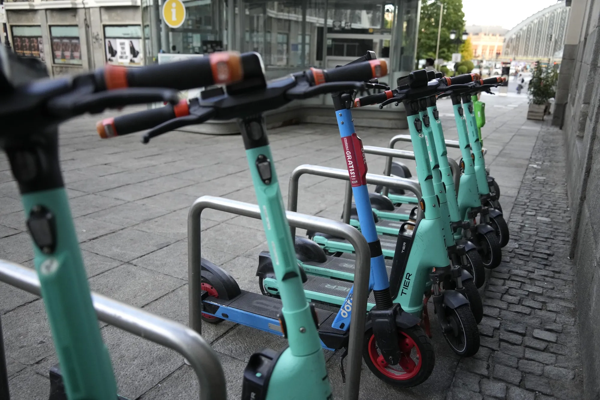A line of Tier Mobility SE&nbsp;e-scooters on a street in central Madrid in 2024. The city has&nbsp;joined Paris in banning the vehicles from its streets.&nbsp;