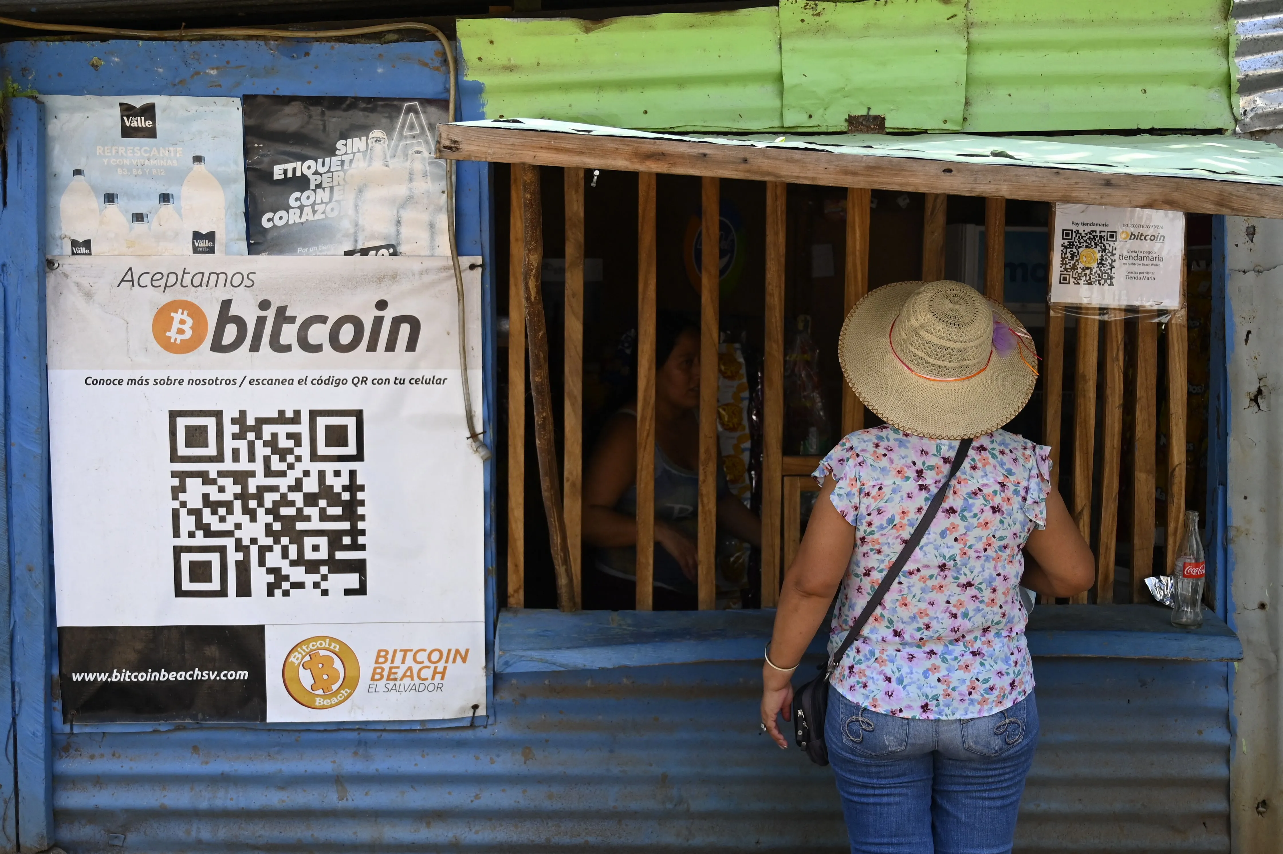 A woman purchases items at a store that accepts bitcoins in El Zonte, El Salvador.