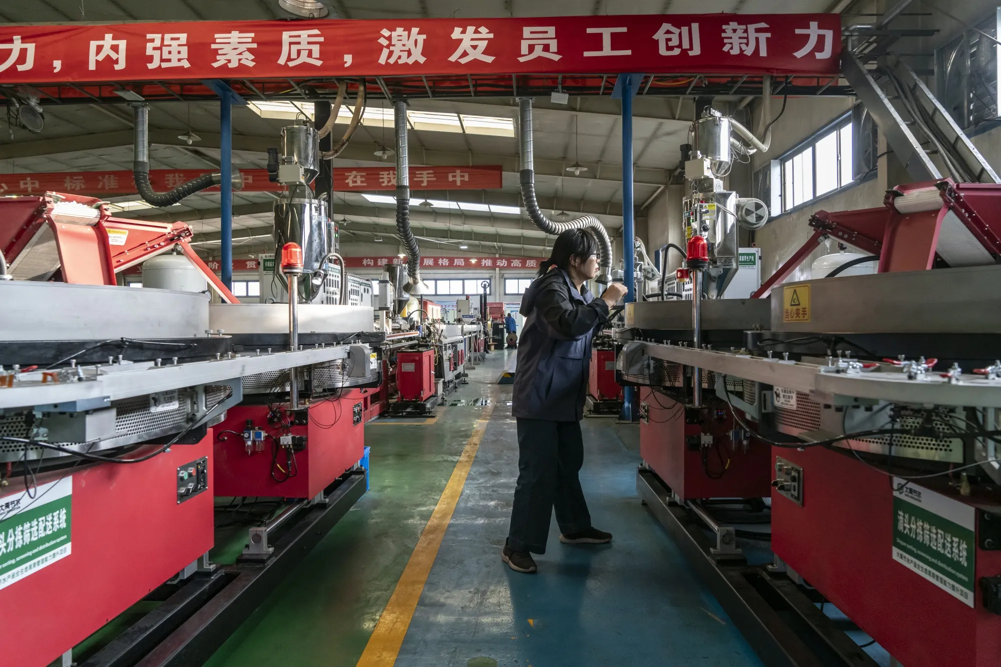 An employee on the production line at a facility in Jiuquan, Gansu province, China.