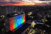 A drone image shows the ABS-CBN ELJ building projecting the company's signature colors.