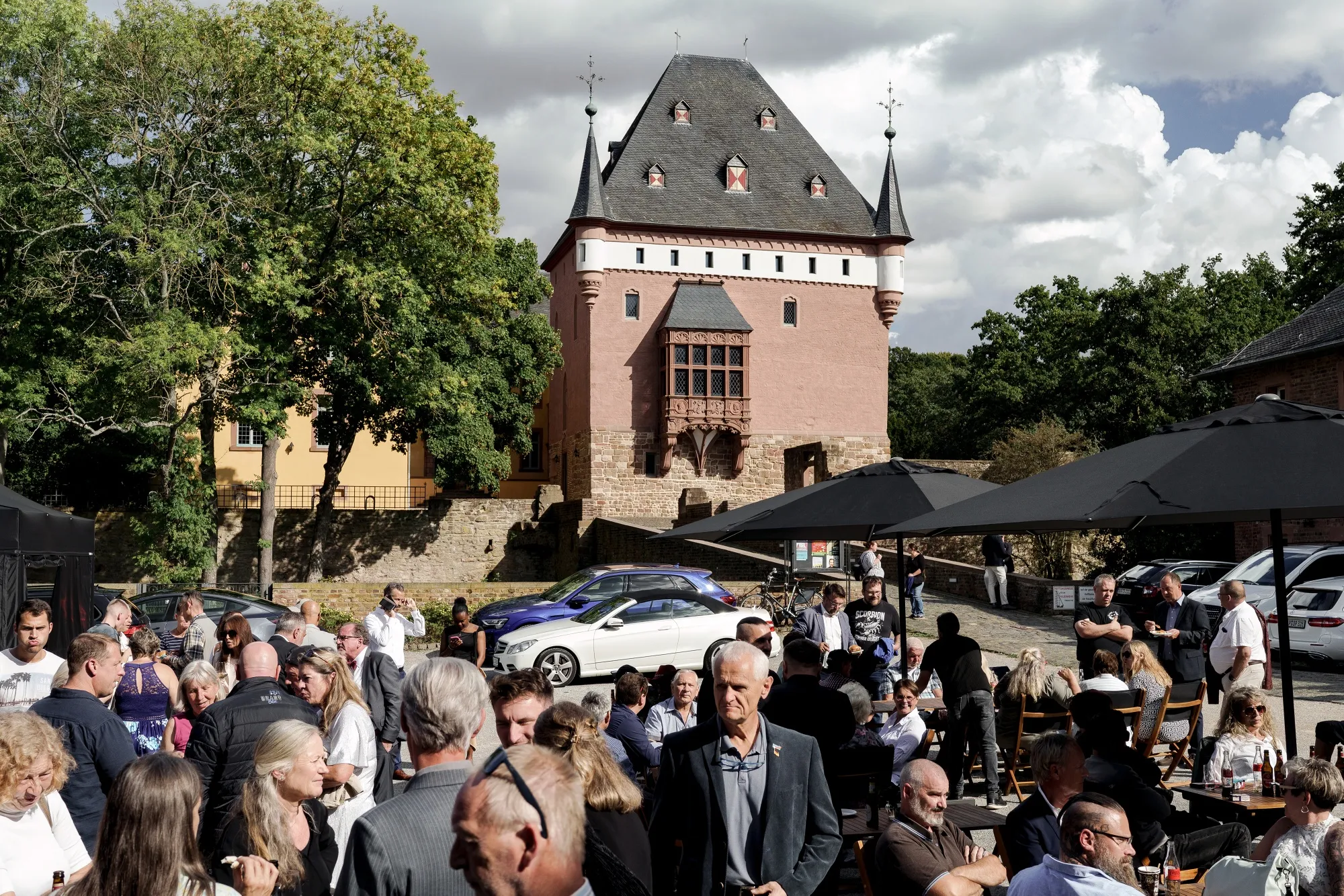 Attendees mingle at the AfD’s closed campaign event&nbsp;at&nbsp;Schloss Burgau in Düren, North Rhine-Westphalia, on Sept. 5.